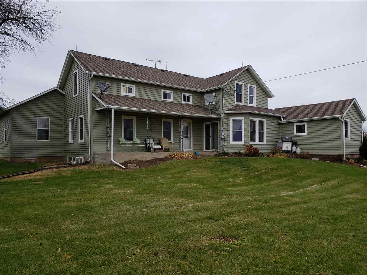 10410 North Church Road Davis, IL 61019 - Photo 1 of 25 a front view of a house with a garden