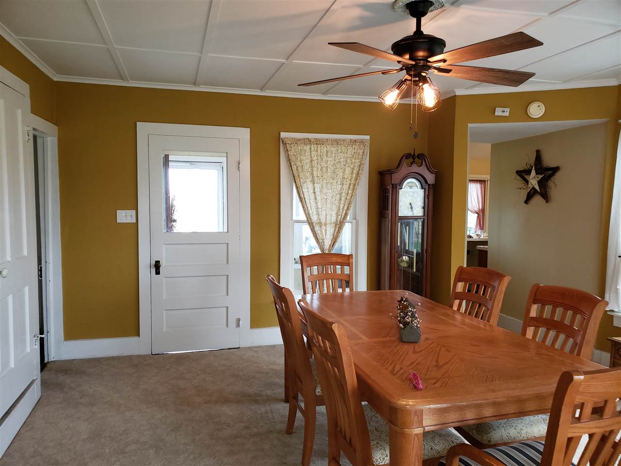 10410 North Church Road Davis, IL 61019 - Photo 11 of 25 a view of a dining room with furniture and a chandelier