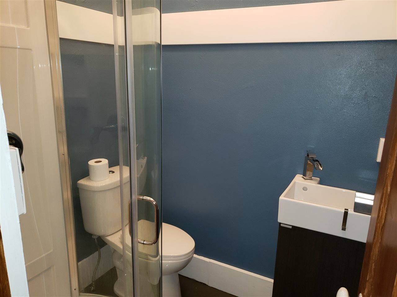 10410 North Church Road Davis, IL 61019 - Photo 13 of 25 a white toilet sitting next to a bathroom sink
