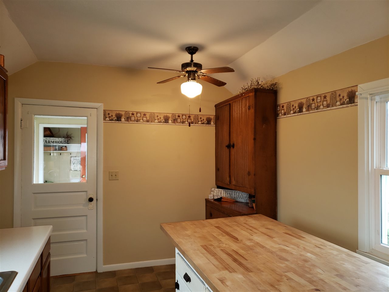 10410 North Church Road Davis, IL 61019 - Photo 19 of 25 a bedroom with a bed and a chandelier