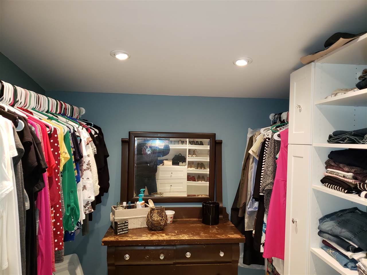 10410 North Church Road Davis, IL 61019 - Photo 4 of 25 a view of walk in closet with clothes and shoes