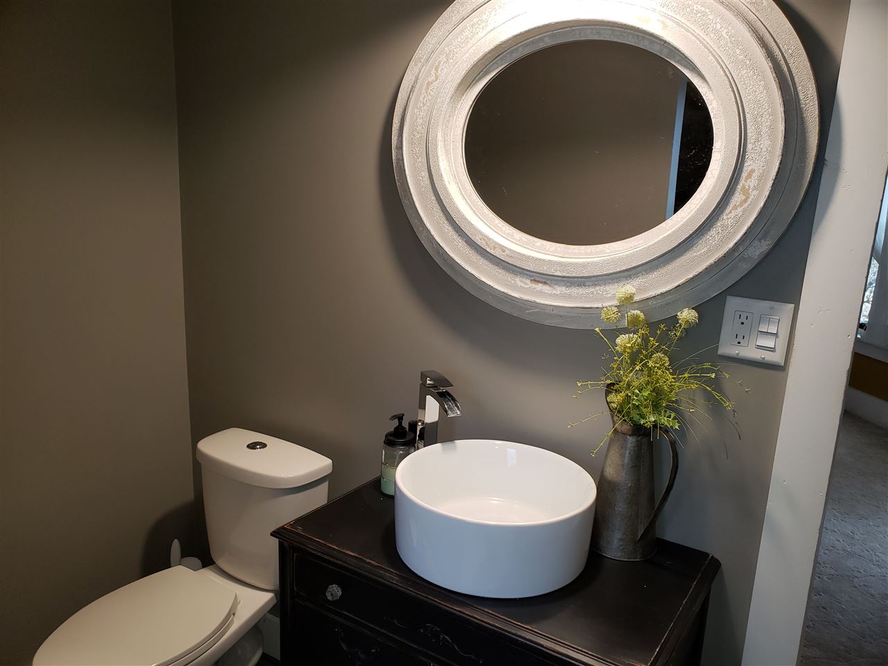 10410 North Church Road Davis, IL 61019 - Photo 9 of 25 a bathroom with a toilet a sink and a mirror