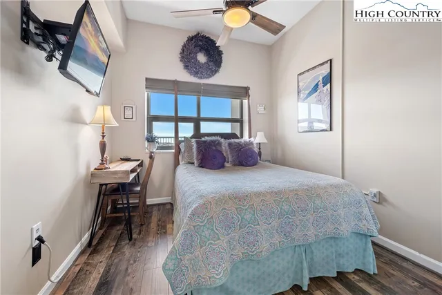 a bedroom with a bed and a table