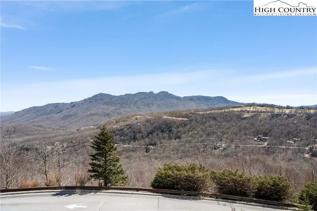 a view of a town with mountains in the background