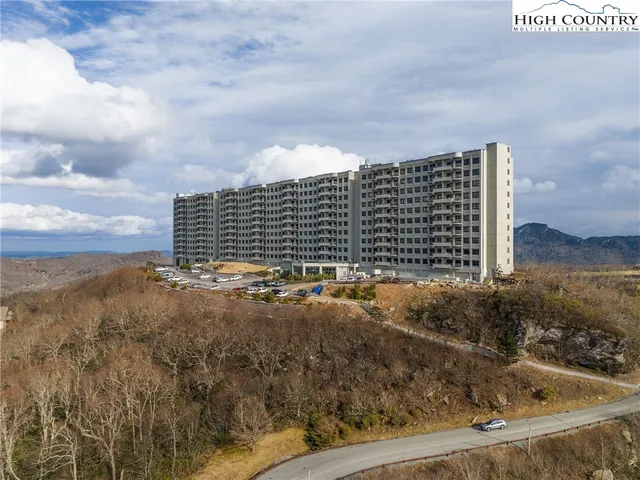 a view of roof with city view