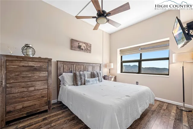 a bed room with a bed and a window