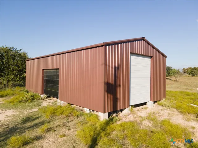 a view of a backyard of garage