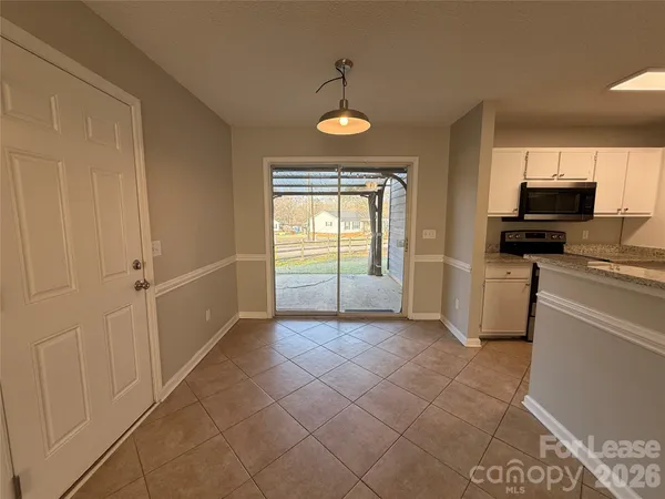 a view of a kitchen with a sink cabinets and a window