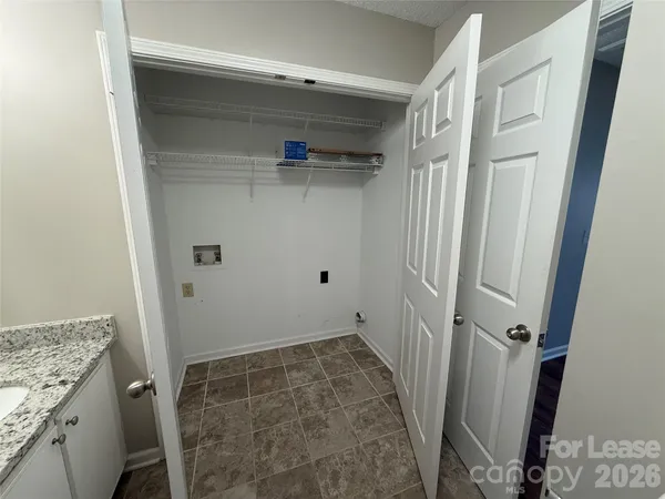 a bathroom with a granite countertop sink