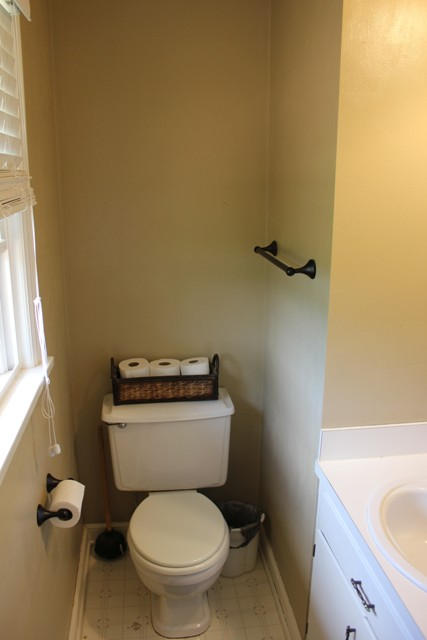 401 Monty Road Boones Mill, VA 24065 - Photo 16 of 30 a white toilet sitting next to a bathroom sink
