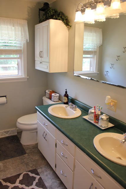 401 Monty Road Boones Mill, VA 24065 - Photo 19 of 30 a bathroom with a granite countertop sink mirror vanity and toilet