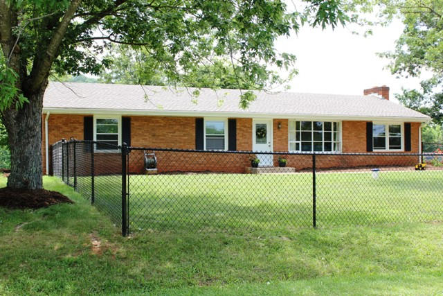 401 Monty Road Boones Mill, VA 24065 - Photo 3 of 30 a view of a house with a backyard