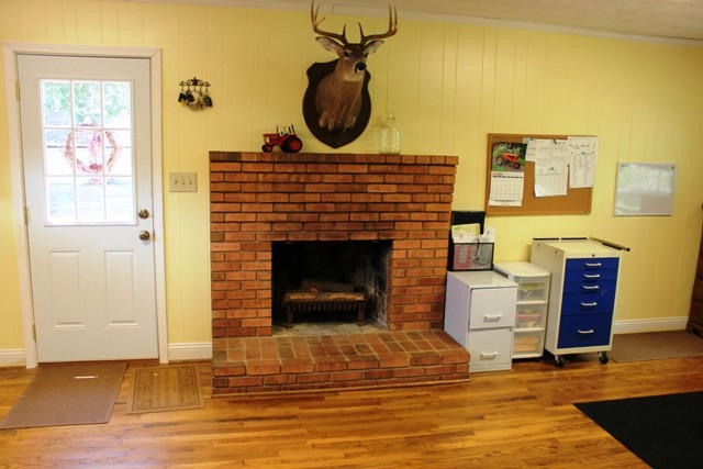 401 Monty Road Boones Mill, VA 24065 - Photo 22 of 30 a living room with furniture a flat screen tv and a fireplace