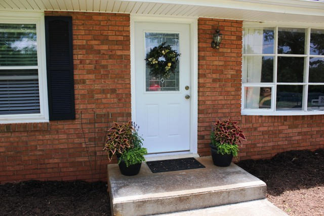 401 Monty Road Boones Mill, VA 24065 - Photo 23 of 30 a view of a door of the house with potted plants