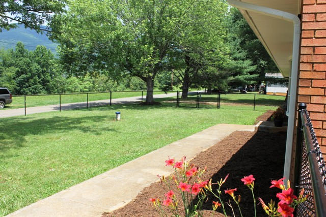 401 Monty Road Boones Mill, VA 24065 - Photo 24 of 30 a backyard of a house with lots of green space