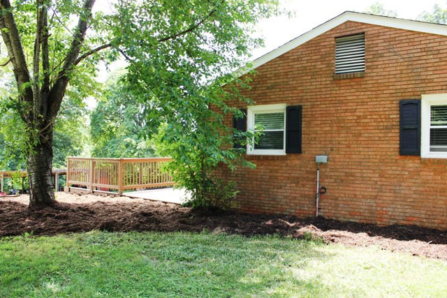401 Monty Road Boones Mill, VA 24065 - Photo 25 of 30 a backyard of a house with lots of green space