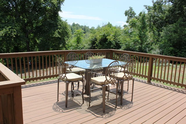 401 Monty Road Boones Mill, VA 24065 - Photo 28 of 30 a view of a deck with a table and chairs with wooden floor