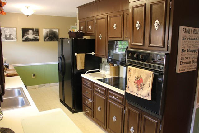 401 Monty Road Boones Mill, VA 24065 - Photo 8 of 30 a kitchen with kitchen island granite countertop a refrigerator and a sink