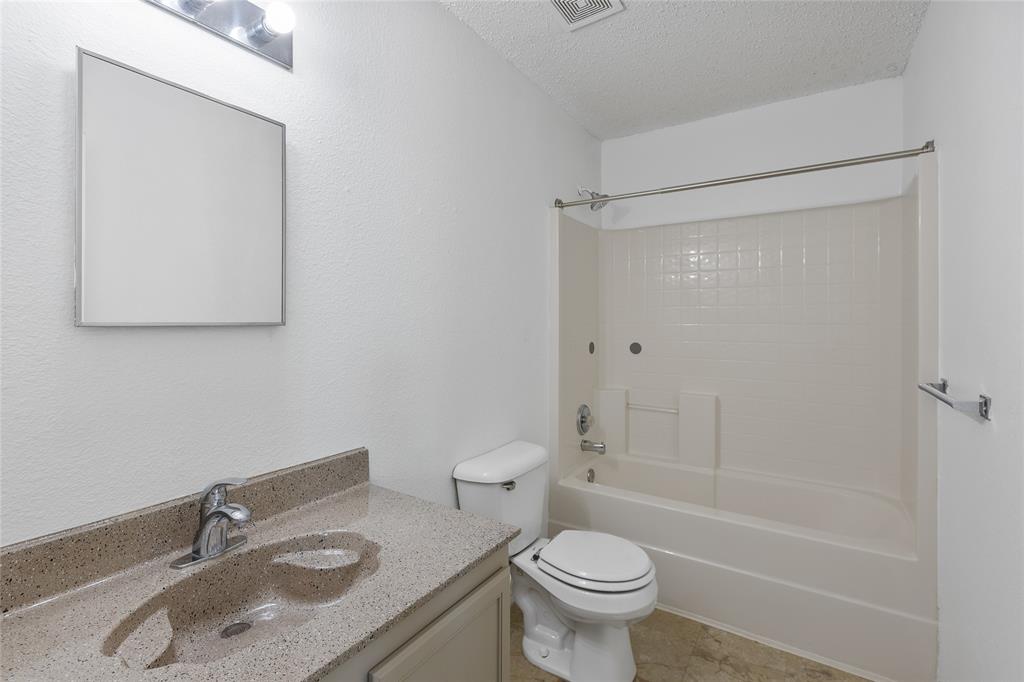 1628 Fieldstone Drive Little Elm, TX 75068 - Photo 24 of 32 a bathroom with a sink toilet and shower