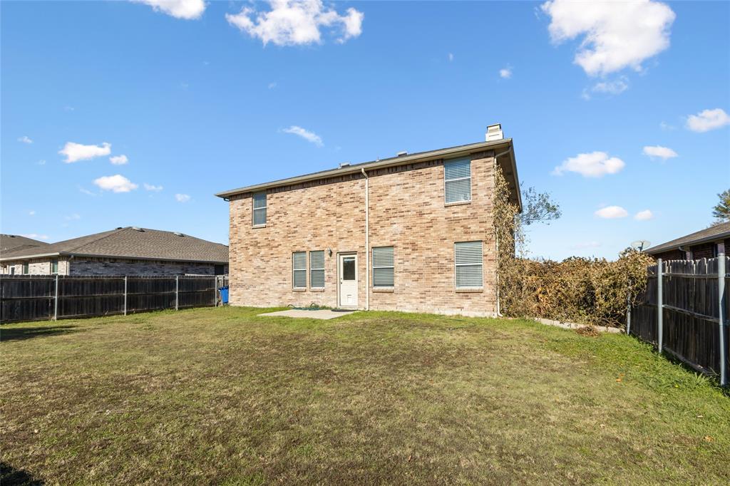 1628 Fieldstone Drive Little Elm, TX 75068 - Photo 31 of 32 a view of a house with yard and sitting area