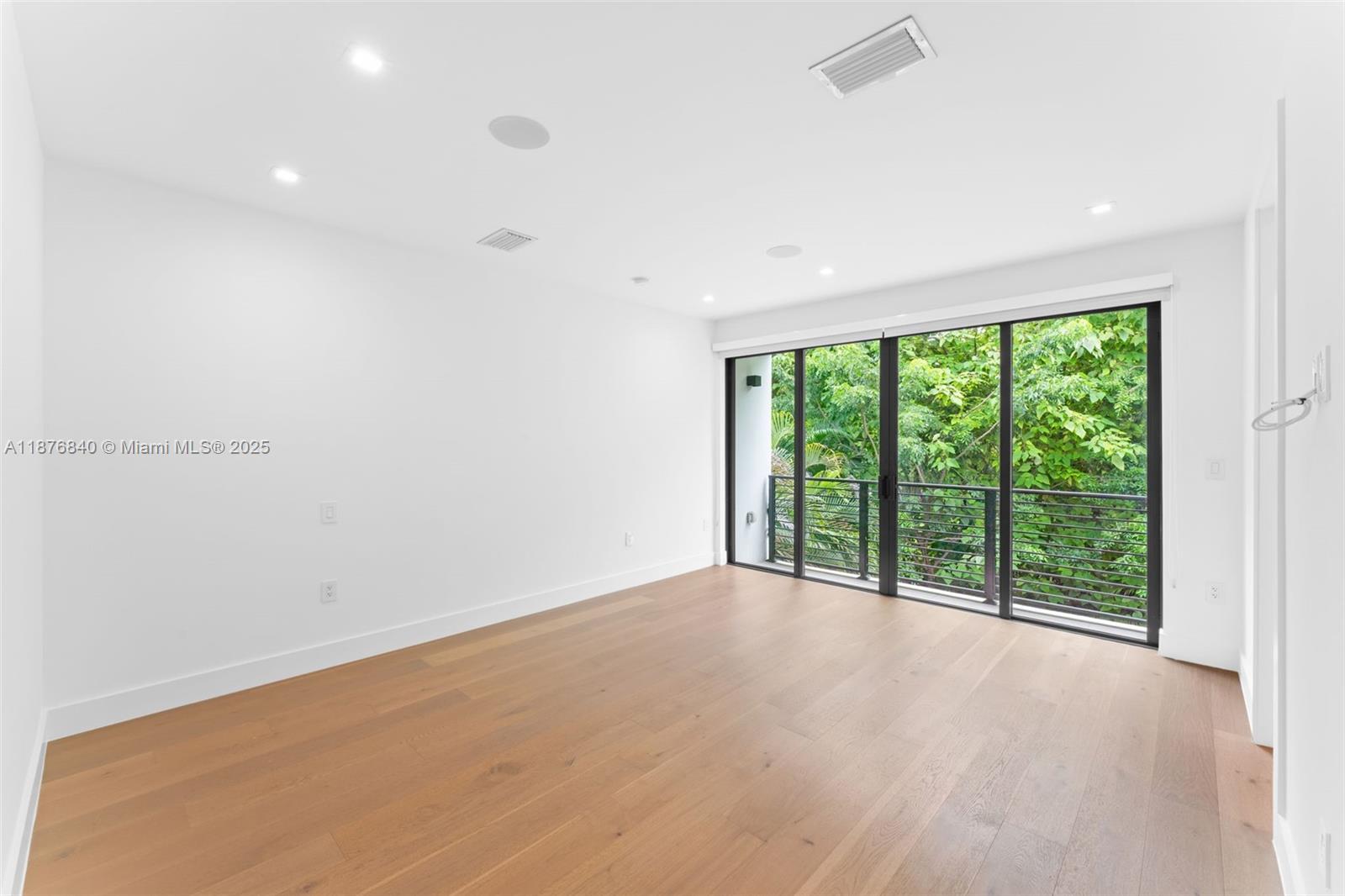 3132 Plaza Street Miami, FL 33133 - Photo 13 of 36 an empty room with large windows