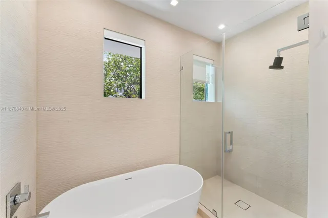 a bathroom with a toilet and shower