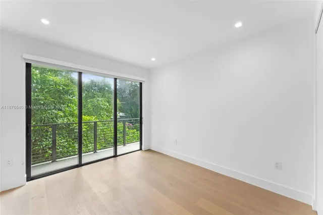 a view of a room with large windows