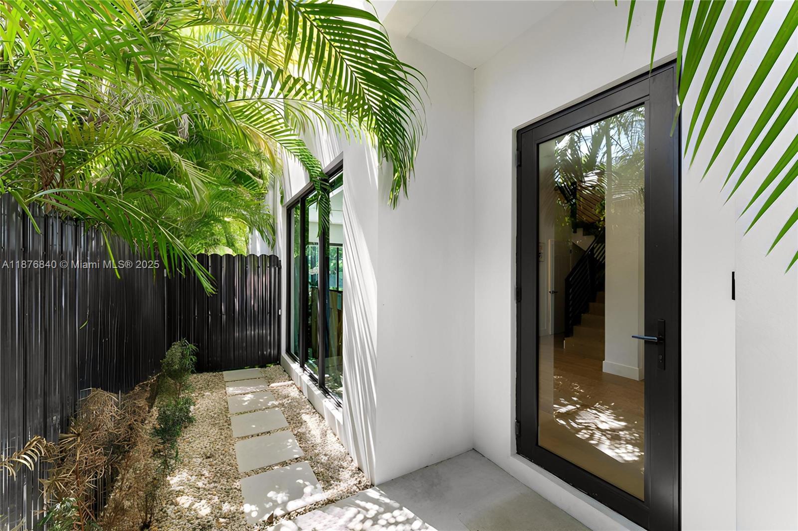 3132 Plaza Street Miami, FL 33133 - Photo 3 of 36 a view of entryway with a garden