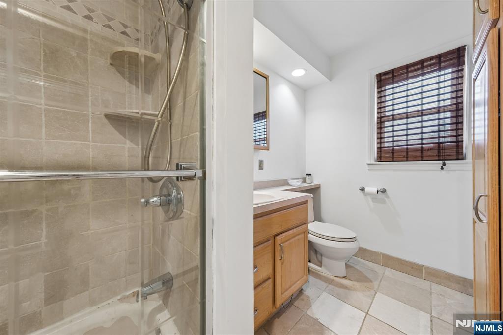 2 Caryn Place Fairfield, NJ 07004 - Photo 14 of 35 a bathroom with a toilet and a shower