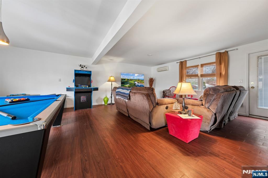 2 Caryn Place Fairfield, NJ 07004 - Photo 16 of 35 a living room with furniture fireplace and dining table