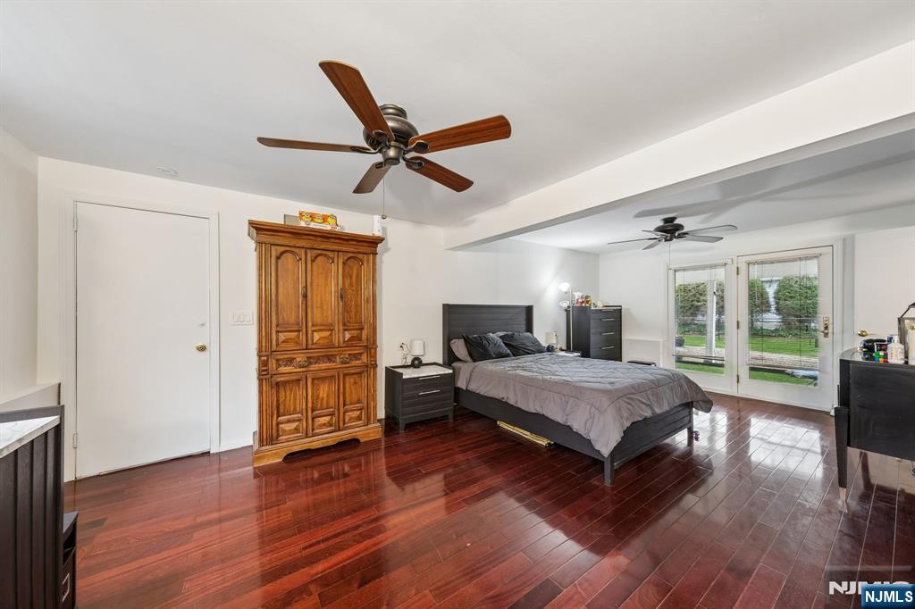 2 Caryn Place Fairfield, NJ 07004 - Photo 25 of 35 a spacious bedroom with a bed and wooden floor
