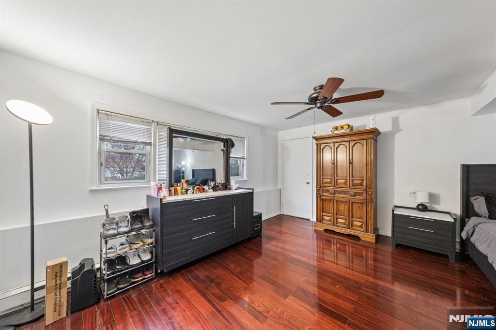 2 Caryn Place Fairfield, NJ 07004 - Photo 26 of 35 a room with furniture and a wooden floor