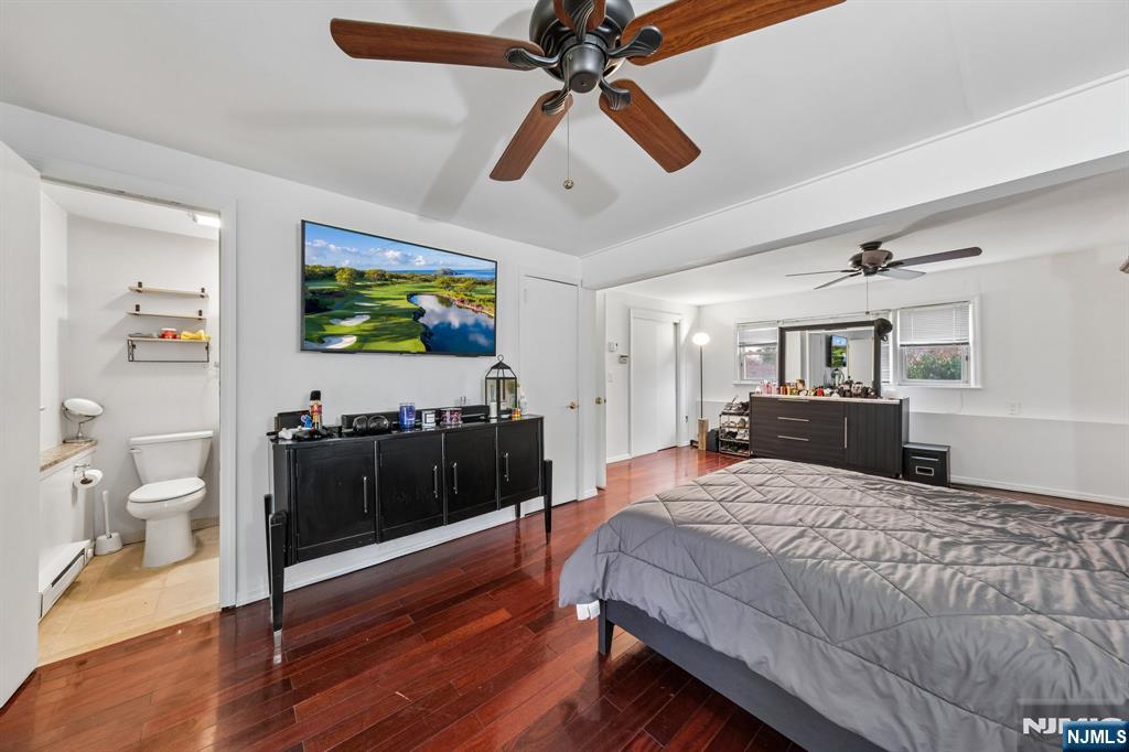 2 Caryn Place Fairfield, NJ 07004 - Photo 27 of 35 a bedroom with a bed and a flat screen tv