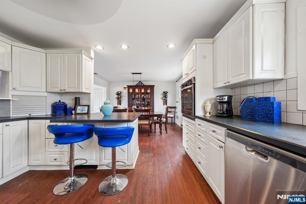 2 Caryn Place Fairfield, NJ 07004 - Photo 4 of 35 a kitchen with furniture and appliances