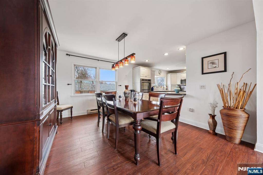 2 Caryn Place Fairfield, NJ 07004 - Photo 7 of 35 a view of a dining room with furniture and wooden floor