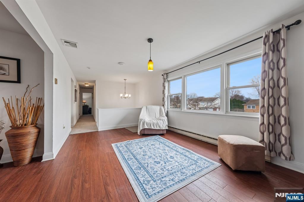 2 Caryn Place Fairfield, NJ 07004 - Photo 9 of 35 a living room with furniture and a rug
