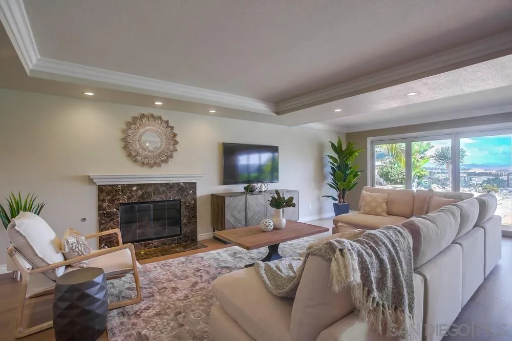 13495 Mango Drive Del Mar, CA 92014 - Photo 12 of 53 a living room with furniture a fireplace and a large window