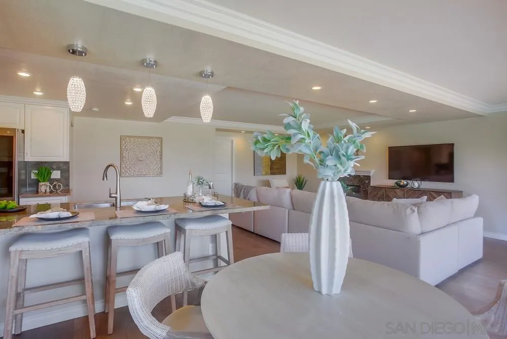 13495 Mango Drive Del Mar, CA 92014 - Photo 14 of 53 a living room with furniture a flat screen tv and a large window