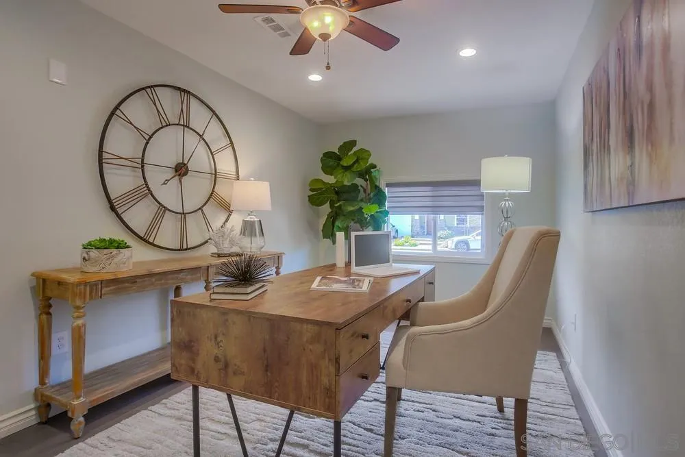 13495 Mango Drive Del Mar, CA 92014 - Photo 26 of 53 a dining room with furniture and wooden floor