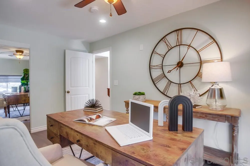 13495 Mango Drive Del Mar, CA 92014 - Photo 27 of 53 a living room with furniture a mirror and a table