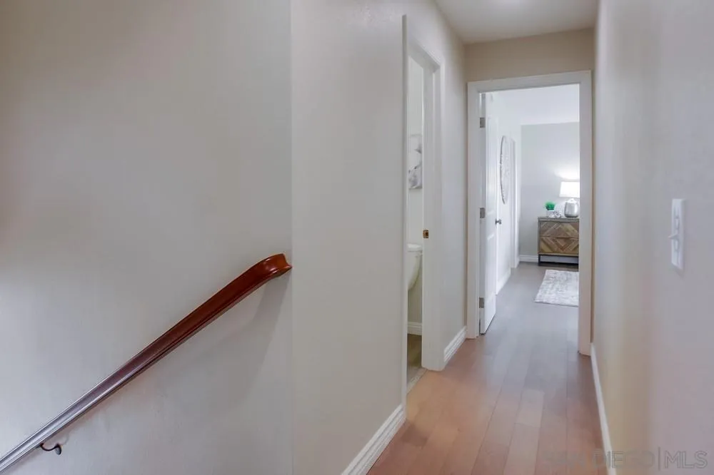 13495 Mango Drive Del Mar, CA 92014 - Photo 29 of 53 a view of a hallway with wooden floor