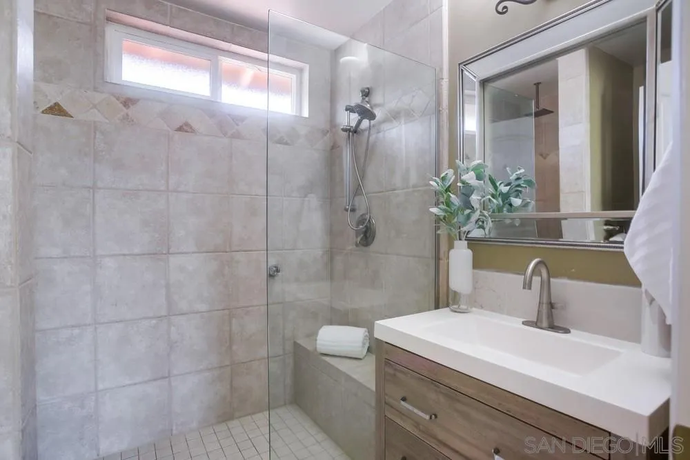 13495 Mango Drive Del Mar, CA 92014 - Photo 35 of 53 a bathroom with a sink a toilet and shower