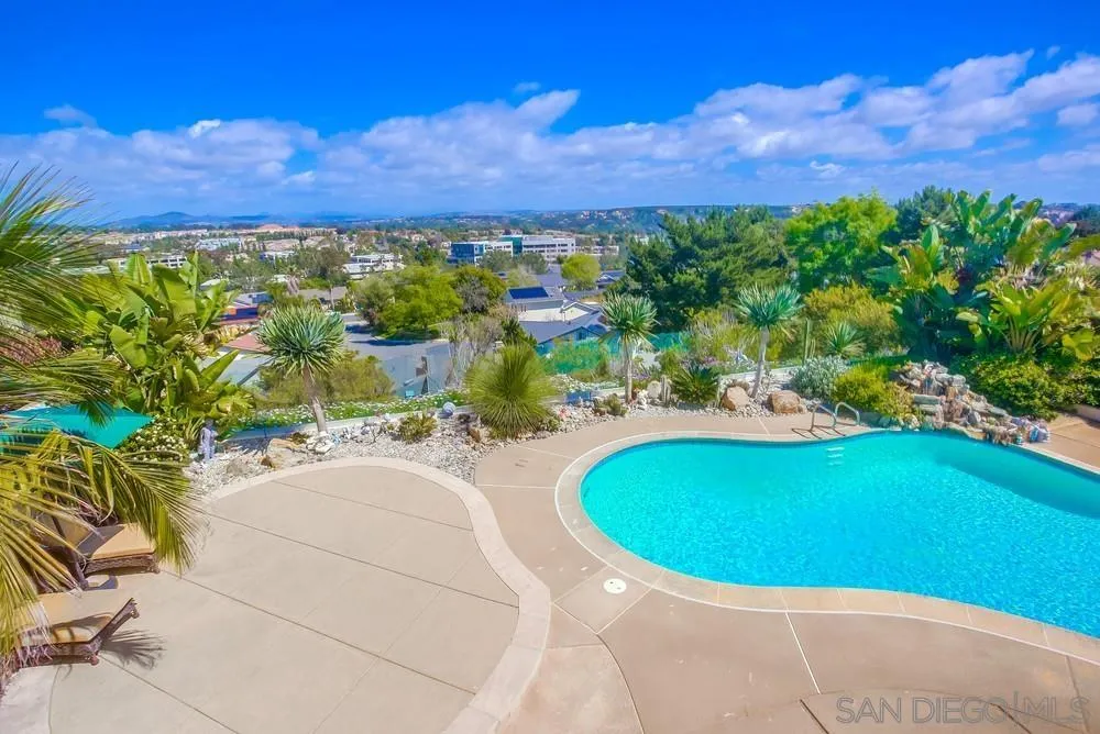 13495 Mango Drive Del Mar, CA 92014 - Photo 37 of 53 a view of a swimming pool with a yard