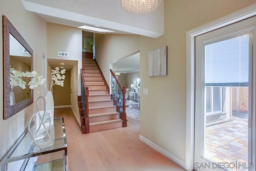 13495 Mango Drive Del Mar, CA 92014 - Photo 4 of 53 a view of entryway and hall with wooden floor