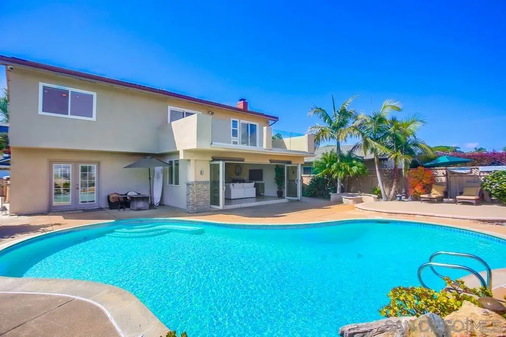 13495 Mango Drive Del Mar, CA 92014 - Photo 50 of 53 a front view of a house with a yard table and chairs