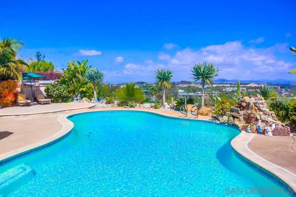 13495 Mango Drive Del Mar, CA 92014 - Photo 51 of 53 a view of a swimming pool with an outdoor seating and a yard
