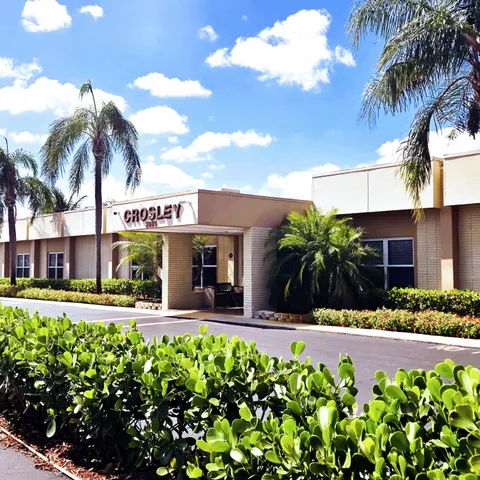 a view of a living room and entryway