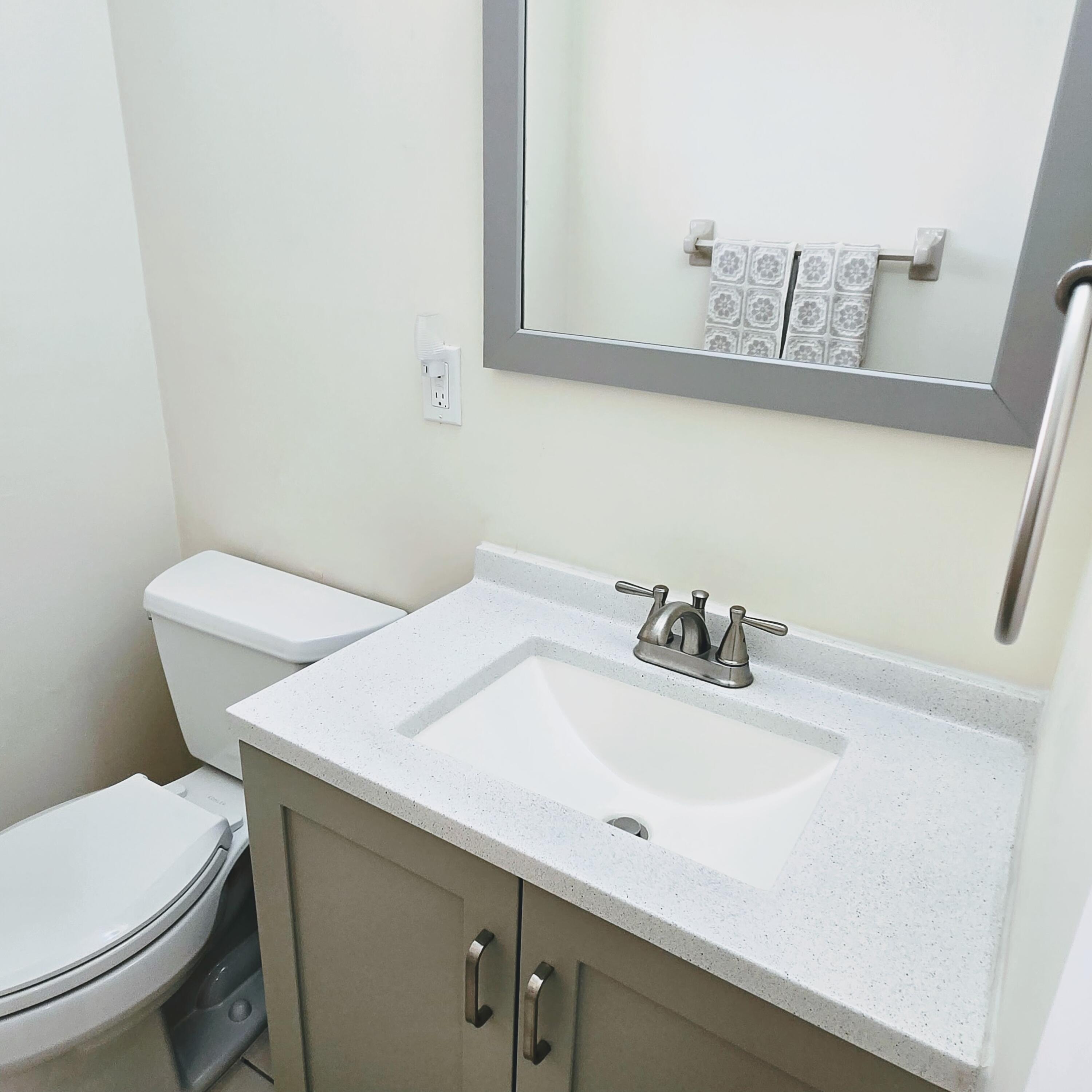 2930 Crosley Drive East, Unit C West Palm Beach, FL 33415 - Photo 9 of 21 a bathroom with a sink and a toilet