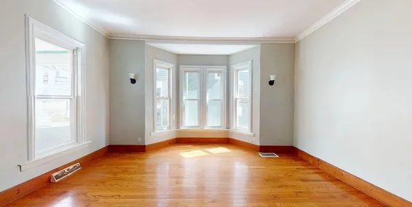 a view of a livingroom with wooden floor