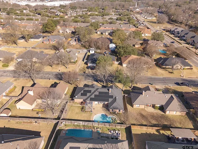 an aerial view of residential houses with outdoor space